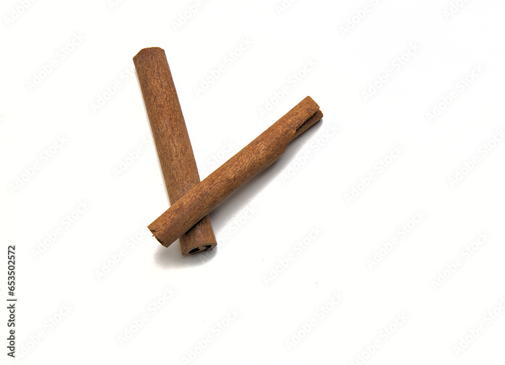 two cinnamon sticks isolated on a white background (spices for cooking cut out) pumpkin spice, indian food, pie, dessert two cinnamon sticks isolated on a white background (spices for cooking cut out) pumpkin spice, indian food, pie, dessert