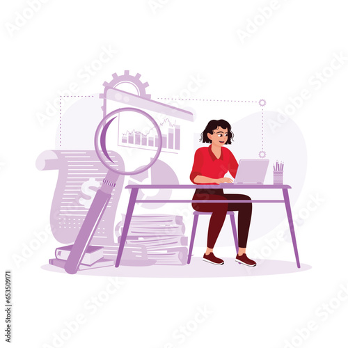 A young accountant working in front of a laptop checking paper documents and electronic documents. Accounting concepts. Trend Modern vector flat illustration
