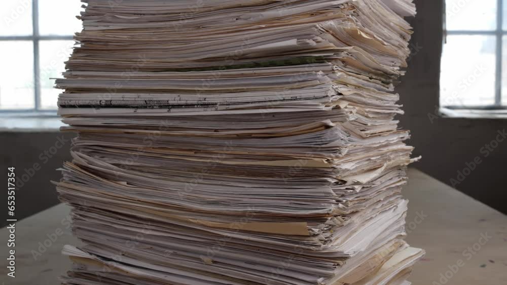 Stack overload document report paper in the office, bureaucracy, paper used business concept. Printed fliers