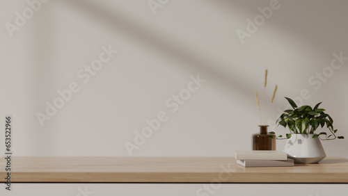 Empty space for your product display on a wooden tabletop against the white wall.