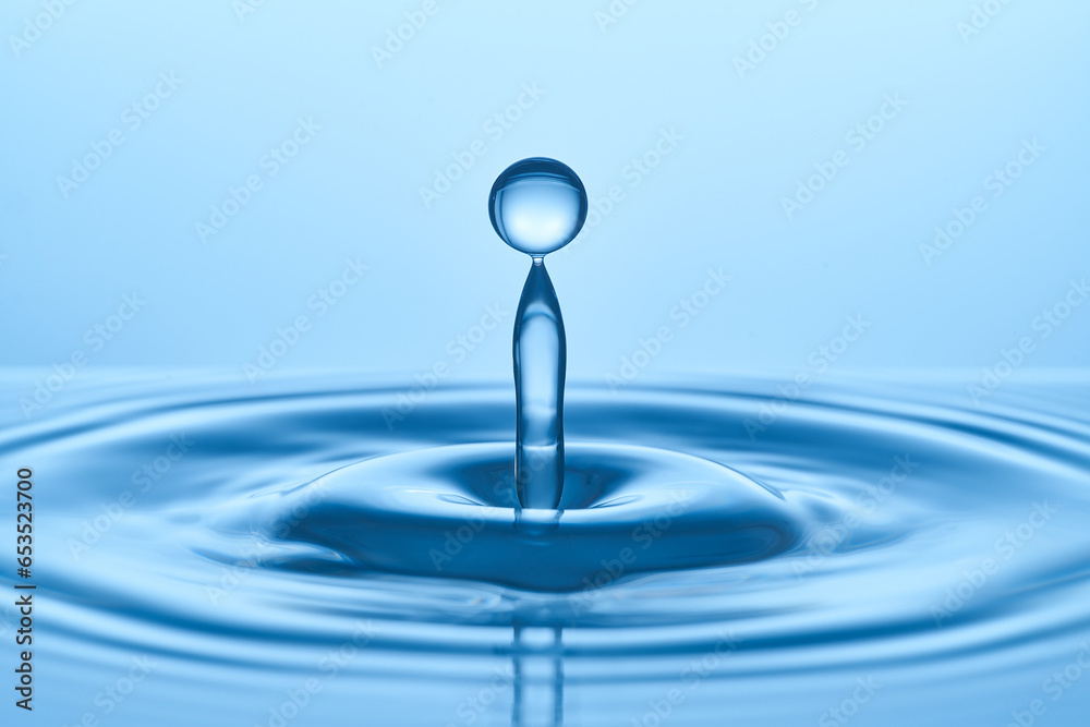 Group of water droplets fall and bounce on a water surface Group of water droplets fall and bounce on a water surface