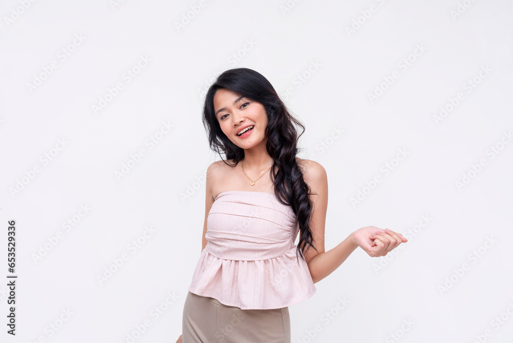 A young pretty asian woman posing with her hand out, seemingly having a conversation. Isolated on a white background. A young pretty asian woman posing with her hand out, seemingly having a conversation. Isolated on a white background.