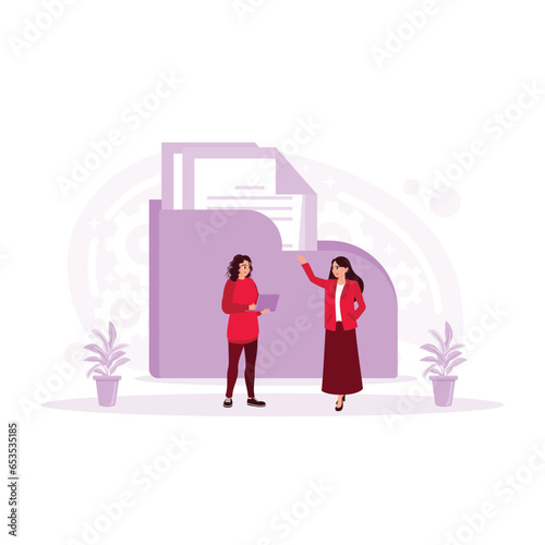 Young accountant checking and saving documents and files in a digital database. Accounting concept. Trend Modern vector flat illustration