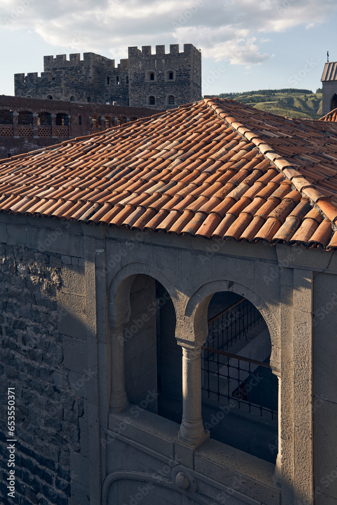 Akhaltsikhe (Rabati) Castle, medieval fortress built in the 9th century. Located in Akhaltsikhe city in southern Georgia. View of the building with tiled roof and arched windows