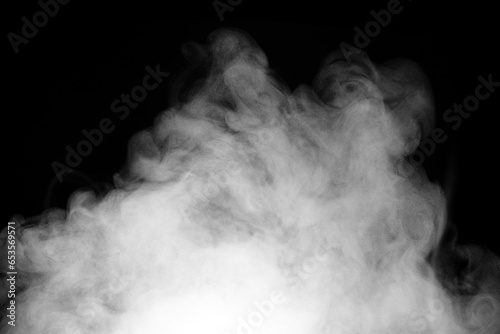 Fragments of abstract white smoke isolated on black background. steam cloud close up