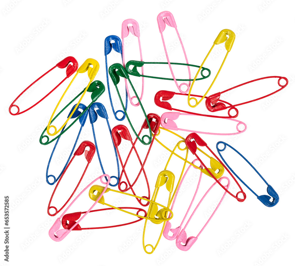 Multicolor safety pins isolated on white background. lots of colorful pins closeup Multicolor safety pins isolated on white background. lots of colorful pins closeup