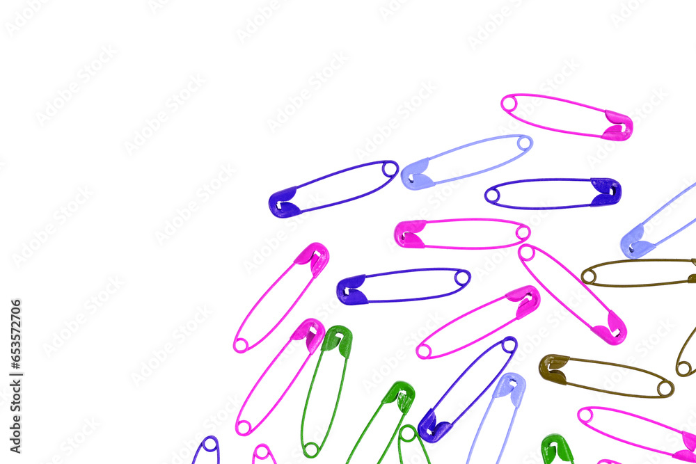 Multicolor safety pins isolated on white background. lots of colorful pins closeup Multicolor safety pins isolated on white background. lots of colorful pins closeup