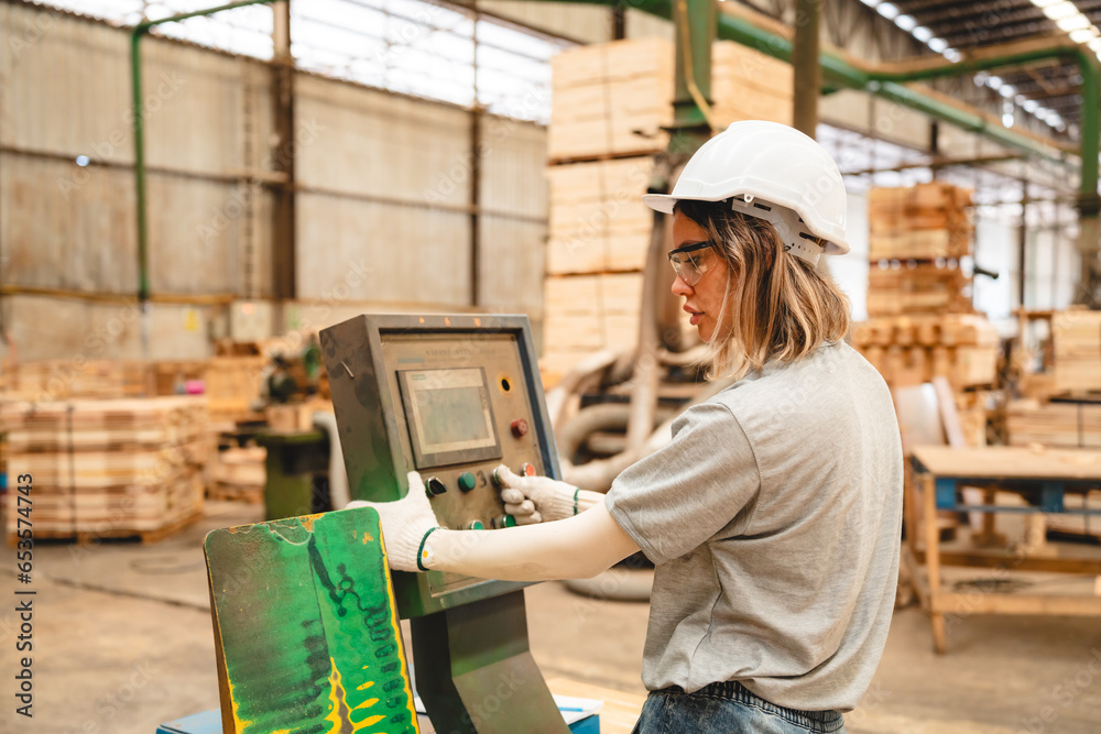 woman carpenter worker wearing safety uniform working to quality control checking of wooden products at workshop manufacturing. female technician making wooden in carpenter's shop industry warehouse.