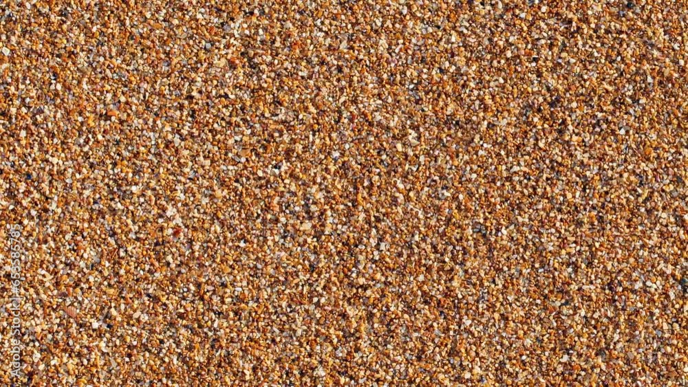 Beach sand moving sideways, close-up macro, top view
Beach sand moving sideways, close-up macro, top view