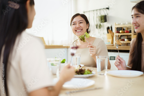 Happy Asian man and women enjoy having a launch together. Group of Asian people have a launch.