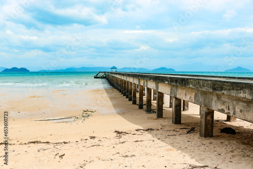 Pier against the backdrop of a beautiful azure bay in a transparent sea  vacation  travel  dream. Copy space.