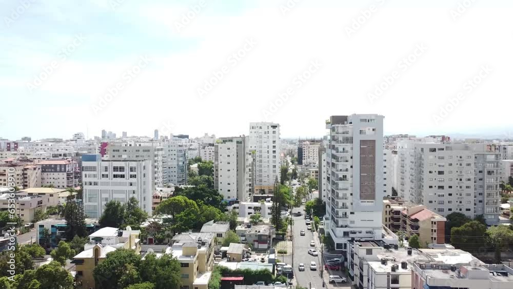 Drone flying with view towards high rise residential buildings in the background. winston churchill avenue, santo domingo Drone flying with view towards high rise residential buildings in the background. winston churchill avenue, santo domingo