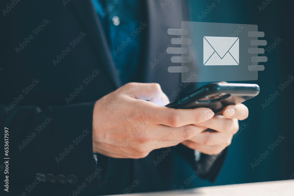 E-mail with notification alert concept. internet technology. Businessman using computer laptop with virtual white newsletter for electronic. E-mail with notification alert concept. internet technology. Businessman using computer laptop with virtual white newsletter for electronic.