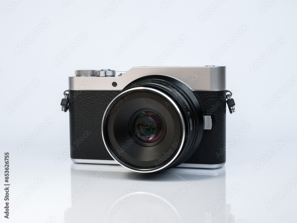 Camera in retro style on a white background with reflection