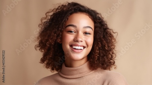 A teenage girl exudes pure joy  her cheerful demeanor captured in a radiant smile.