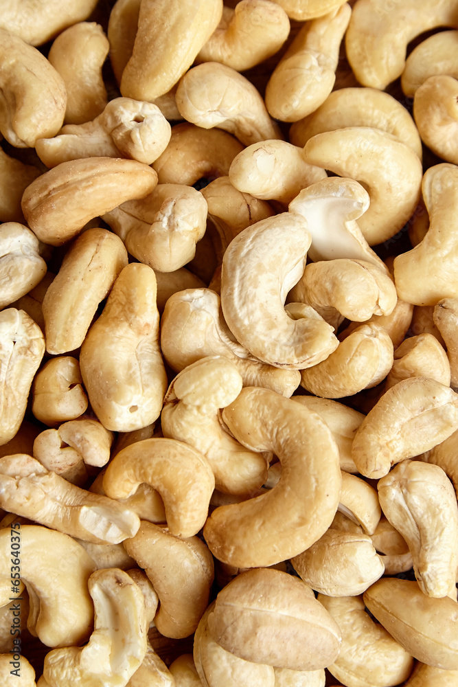 Cashew nut heap food texture background. Wholesome and raw cashew nuts, top view Cashew nut heap food texture background. Wholesome and raw cashew nuts, top view