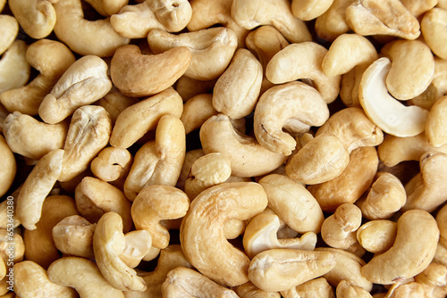 Cashew nut heap food texture background. Nutritious and versatile cashews, top view