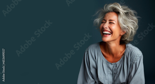 Portrait of a beautiful smiling elderly woman with gray hair photo