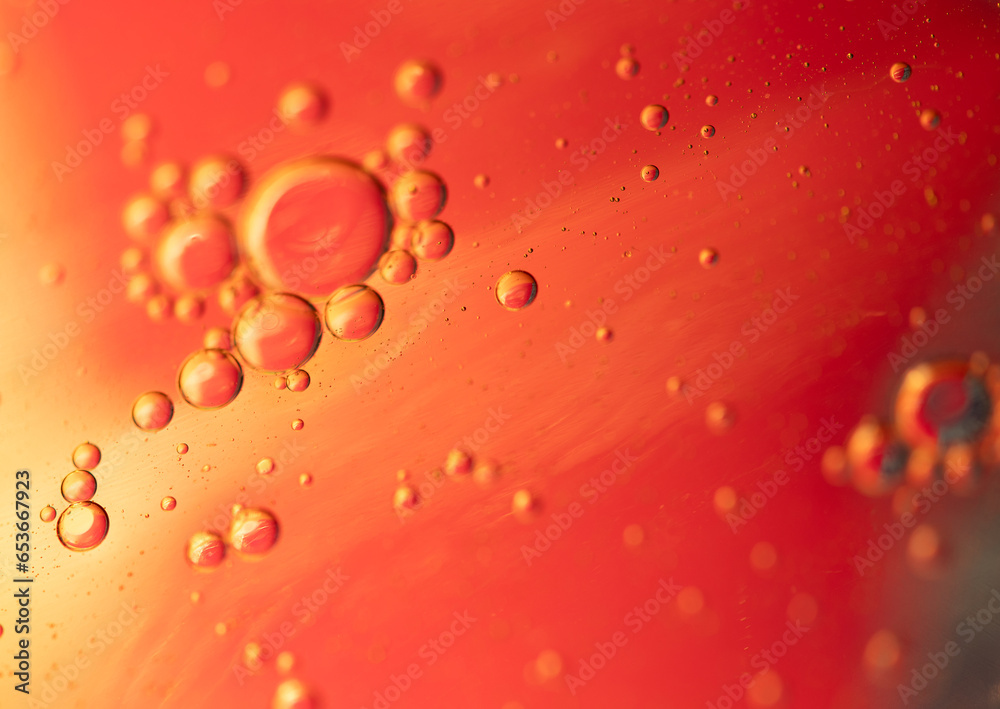 Oil in water, abstract background in yellow and red color tones Oil in water, abstract background in yellow and red color tones