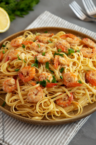 Baked Shrimp Scampi Linguine Pasta with Parsley on a Plate, side view.
