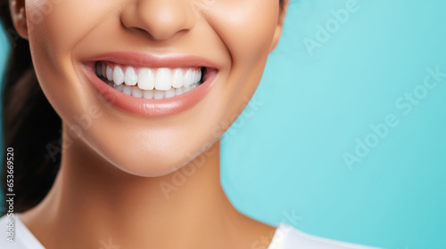 Closeup of woman with a beautiful smile for dental care against a blue background