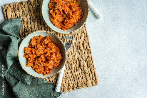 Tasty stew with vegetables on bowl photo