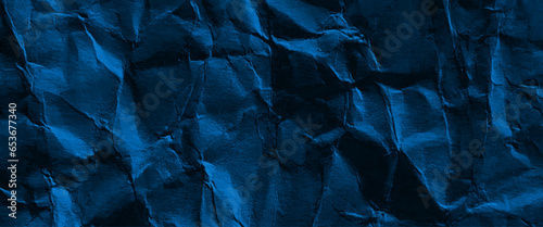 Blue crumpled paper texture background, grunge black and blue crumpled paper texture.

