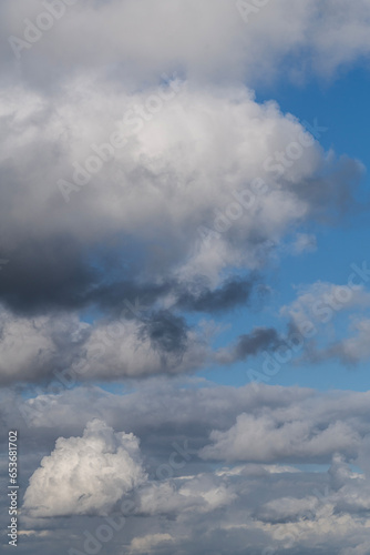 Mixed white and gray clouds on a blue sky in Israel. 