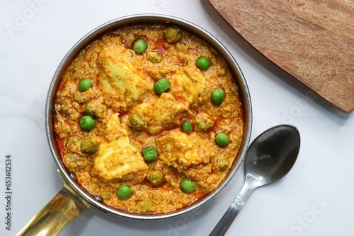 Famous Indian curry dish Paneer matar masala. vegetarian North Indian dish consisting of peas and paneer in a tomato based sauce, spiced with indian spices and garam masala. peas and cottage cheese. 