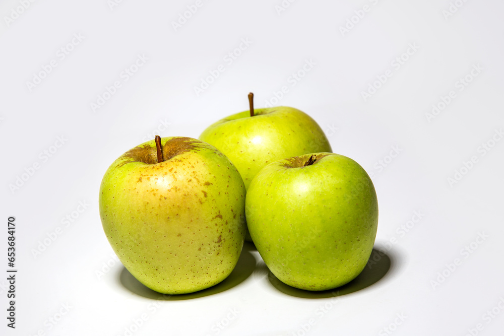 green yellow apples on a white background green yellow apples on a white background