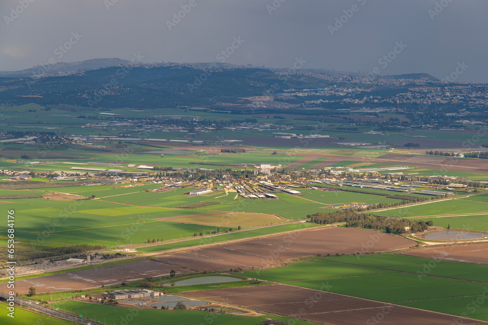View of Kfar Yehoshua from Muhraqa viewpoint on Mount Carmel in Israel. Kfar Yehoshua is a moshav, farming community that is laid out in a circular shape.

