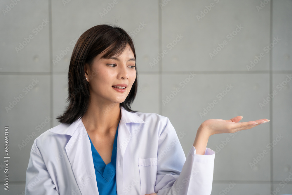 Female doctor looking to camera with smiling at clinic. Healthcare, Retirement, Volunteer, Caregiver and Lifestyle concept. Female doctor looking to camera with smiling at clinic. Healthcare, Retirement, Volunteer, Caregiver and Lifestyle concept.