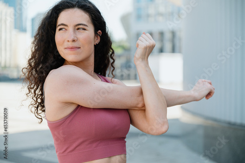 Waist portrait of young woman doing stretching exercises Free Download Waist portrait of young woman doing stretching exercises - GFXLoad