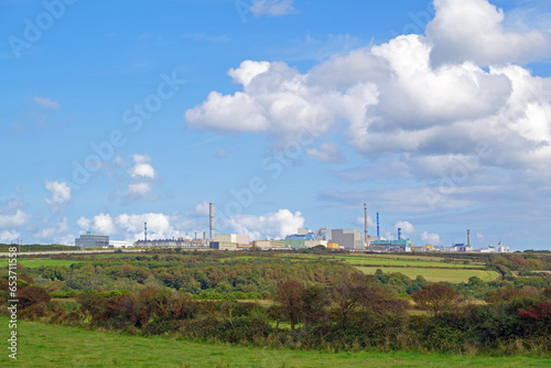 Orano La Hague, the worlds largests nuclear storage and uranium recycling facility, seen from the coastal footpath "Chemin des douaniers" (GR 223) in Cotentin region of Normandy, France