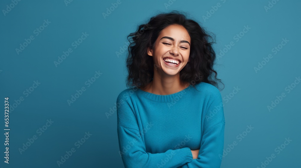 Hispanic woman standing over blue background smiling in love doing heart symbol shape with hands. romantic concept. Hispanic woman standing over blue background smiling in love doing heart symbol shape with hands. romantic concept.