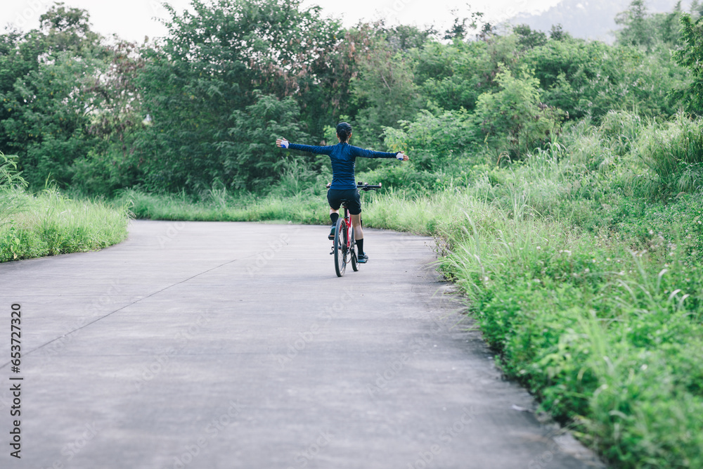 Obraz premium Riding bike in summer forest