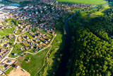 View from a great height of a small cozy village located near the river. Village Krivskoye, Kaluga region, Russia