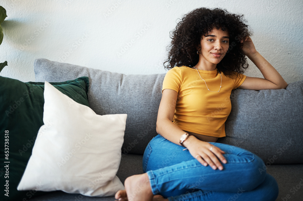 Woman, portrait and thinking on sofa with smile for peace, relaxing in living room apartment or house. Person, face and wellness for self care and zen with ideas, thoughts and inspiration in lounge