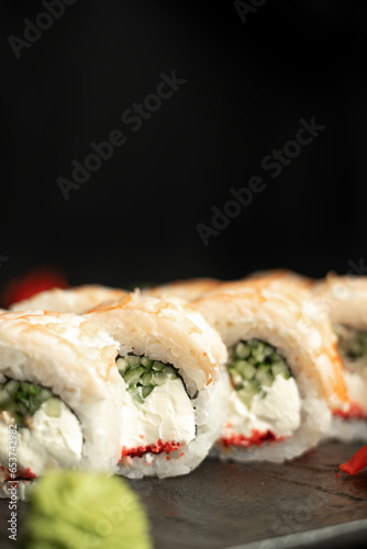 Close-up of king prawn sushi on a black background. Japanese restaurant menu sushi