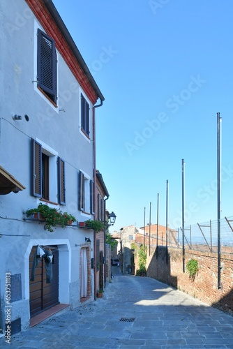 A street in the medieval quarter of Torrita di Siena, a village in Tuscany in Italy. photo