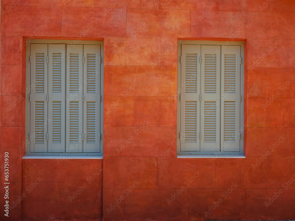 Cute details of windows, doors, balconies from old house in Simi island . Greece islands holidays from Rhodos in Aegean Sea. Colorful neoclassical houses in bay of Symi. Holiday travel background.