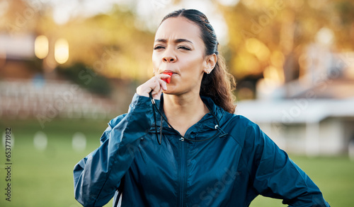 Fototapeta Naklejka Na Ścianę i Meble -  Coach, sports and woman blowing whistle on field for training, planning and challenge for games. Coaching, manager and personal trainer outdoor for exercise, workout schedule and fitness routine
