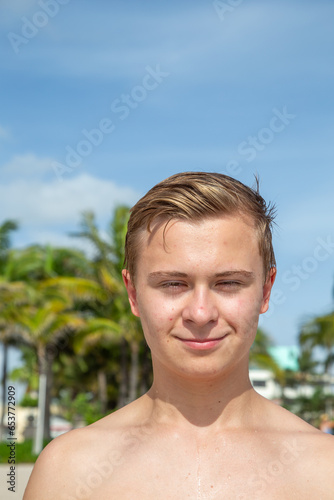 portrait of young teenage boy at the beach photo