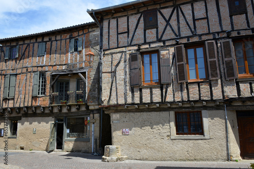 historic half-timbered houses in the medieval village of Lautrec in the department of Tarn photo