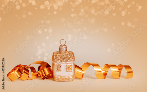 Wallpaper Mural A Christmas toy house stands near a golden serpentine on a yellow background. Housewarming idea for Christmas. Torontodigital.ca