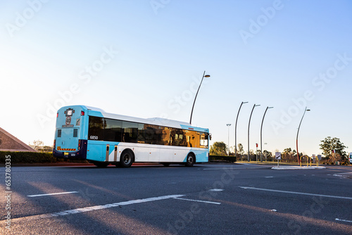Blue bus on road in town - public transport system