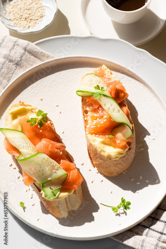  Breakfast in Scandinavian stylet: sandwiches with smoked salmon, cream cheese mousse and cucumber.  Healthy natural quick recipes. Natural beautiful light