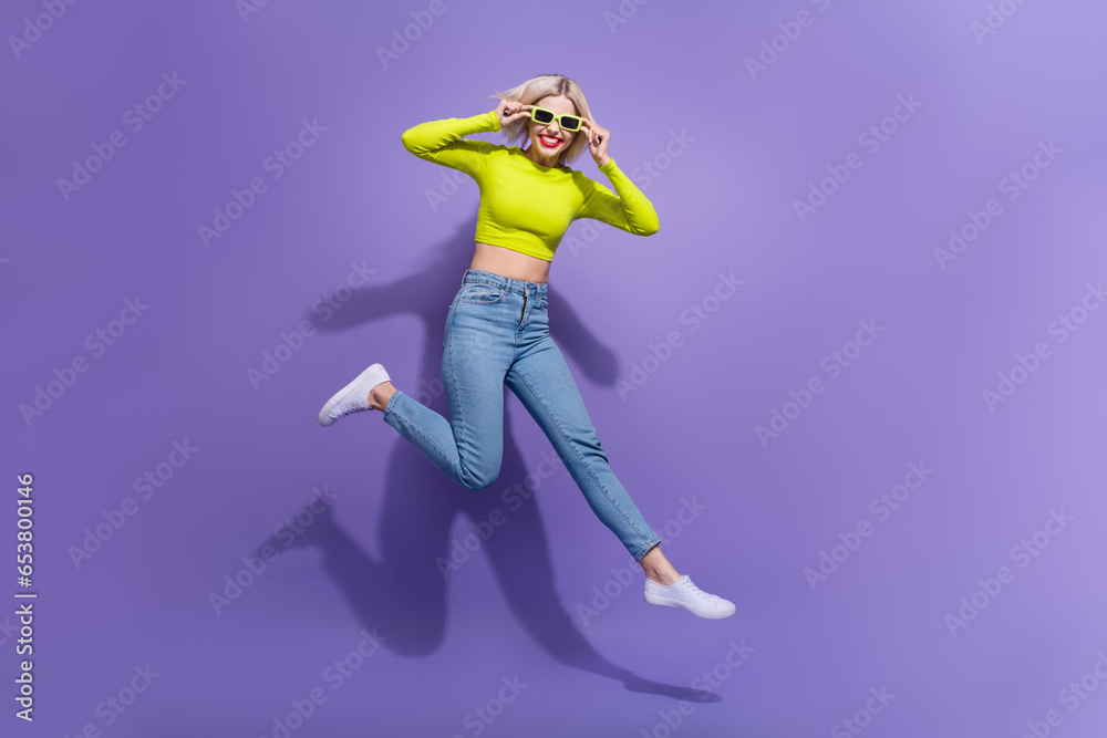 Full length photo of cheerful crazy girl wear stylish clothes hurrying cool party isolated on purple color background