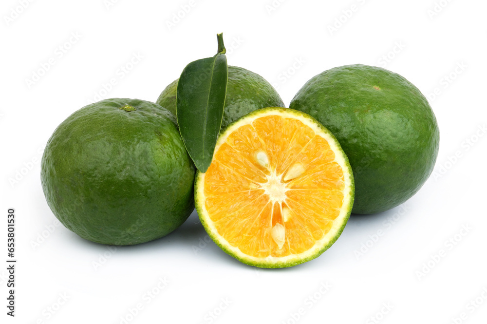Green oranges with leaf isolated on white background. Green oranges with leaf isolated on white background.