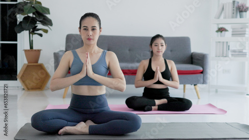 women doing exercise yoga
